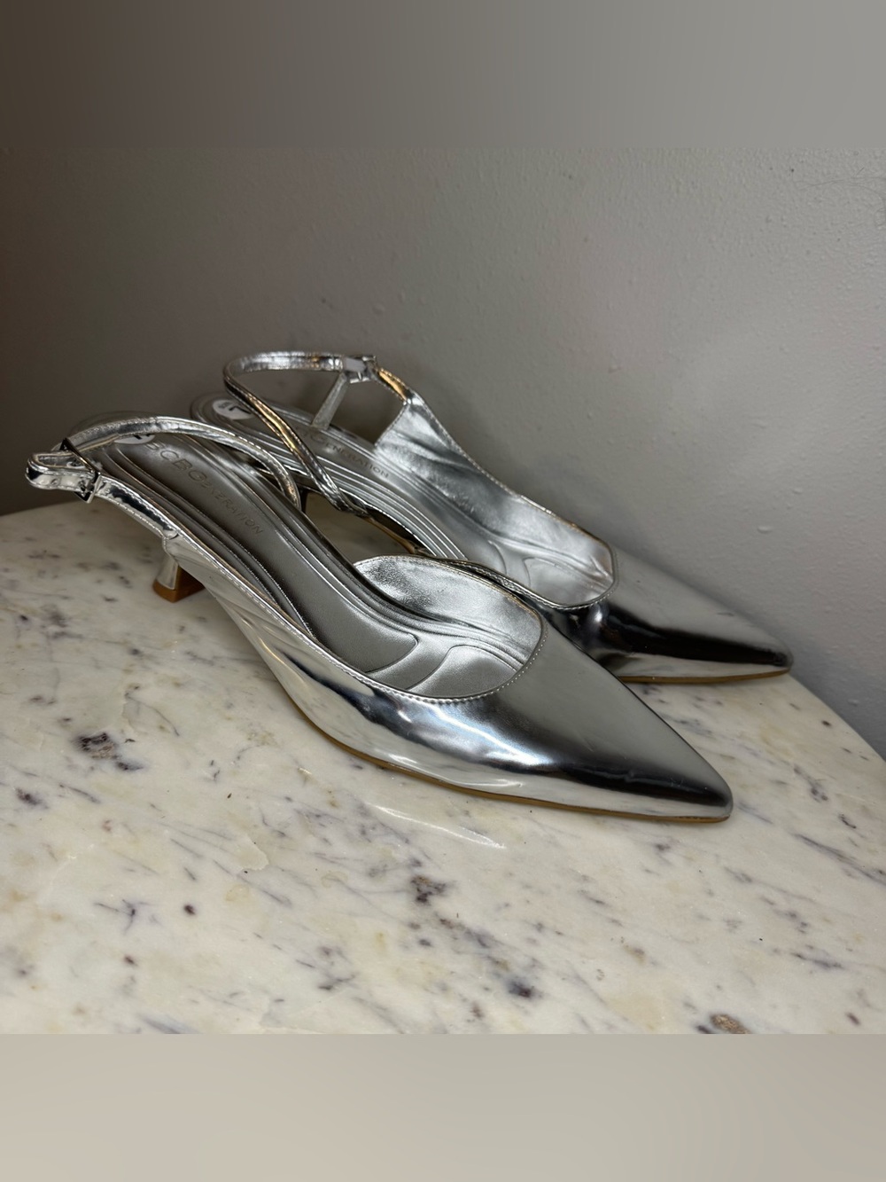 BCBGeneration Heels Size 7.5 M
Vegan leather silver shoes